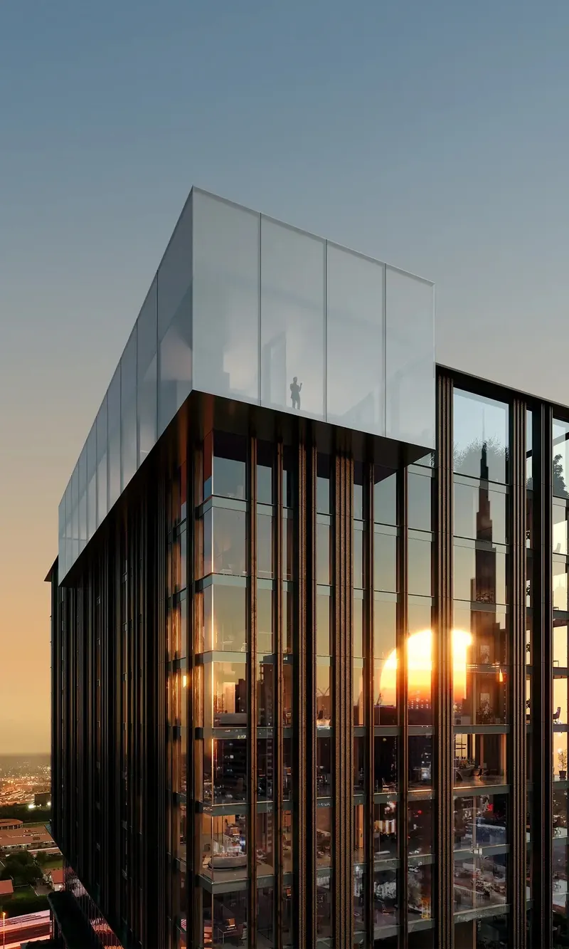 Close render of the glass-walled crown of Haus of Tenet at sunset, with the Burj Khalifa reflected in the facade
