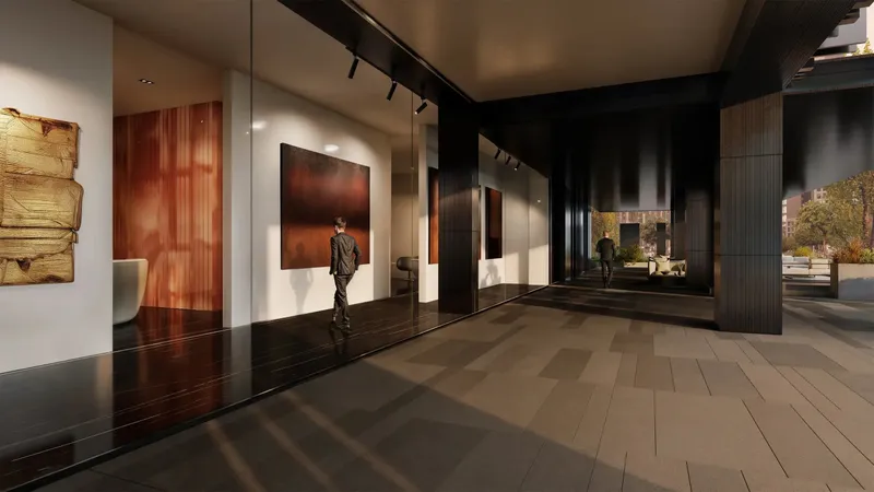 Render of a covered ground-level walkway at Haus of Tenet with large artworks displayed behind glass