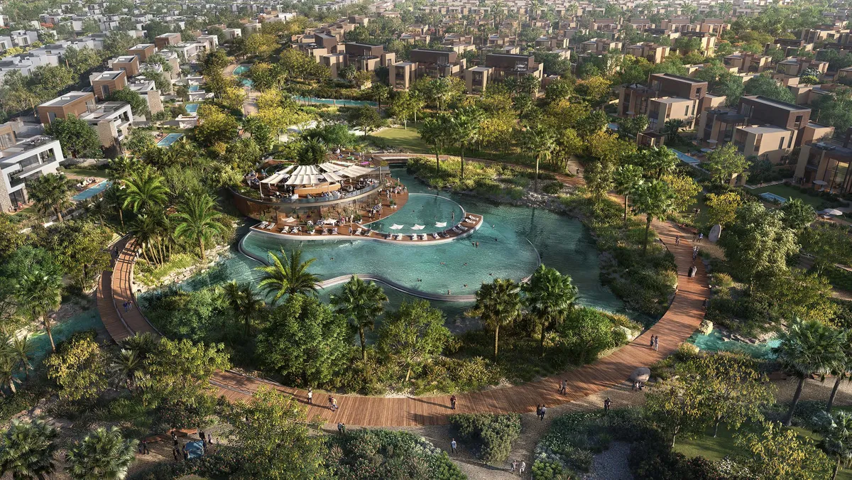 Aerial render of the Haven by Aldar lagoon, pavilion and boardwalk surrounded by villas in Dubailand