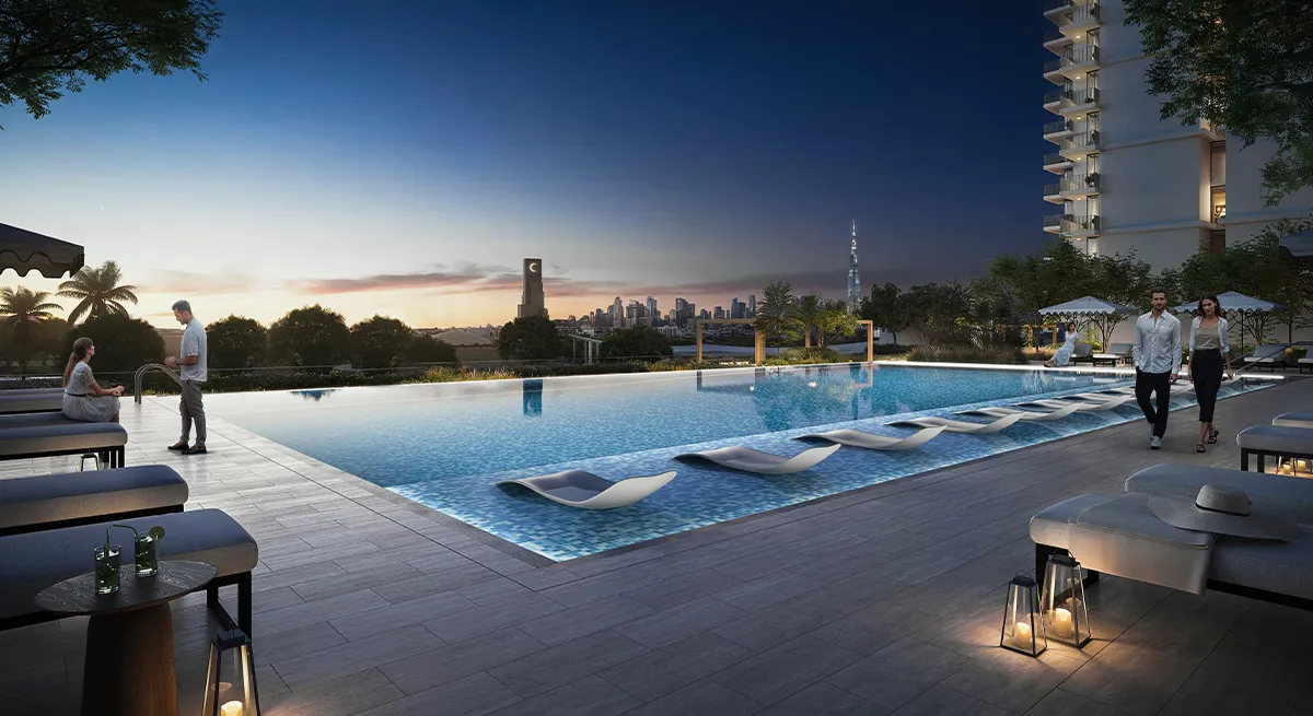 Render of the Hillsedge swimming pool and deck at dusk with the Dubai skyline in the distance