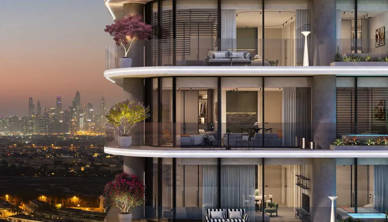 Curved balconies with planters and full-height glazing on Interstellar Tower, with the city lights behind