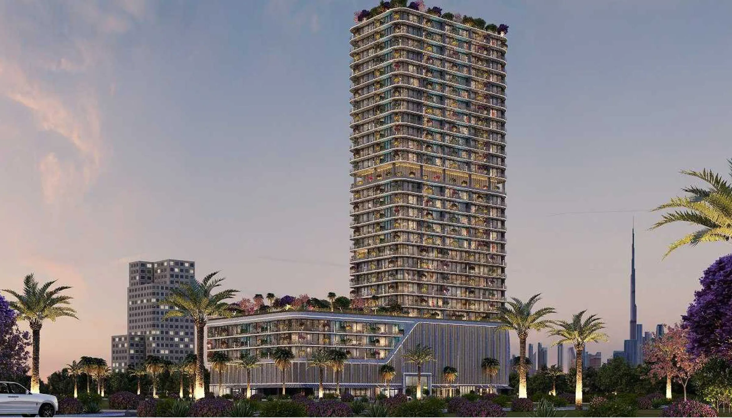 Interstellar Tower rising above its podium among palm trees, with the Burj Khalifa on the skyline