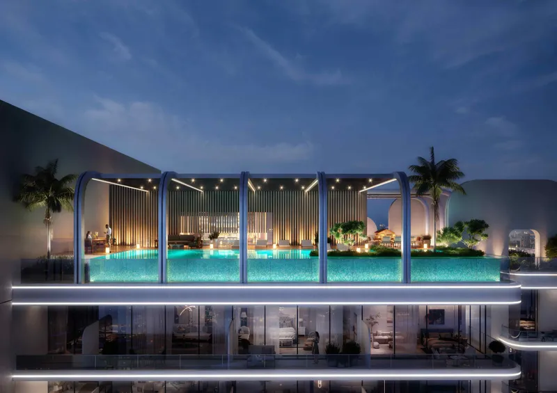 Lit rooftop pool at Le Blanc in the evening
