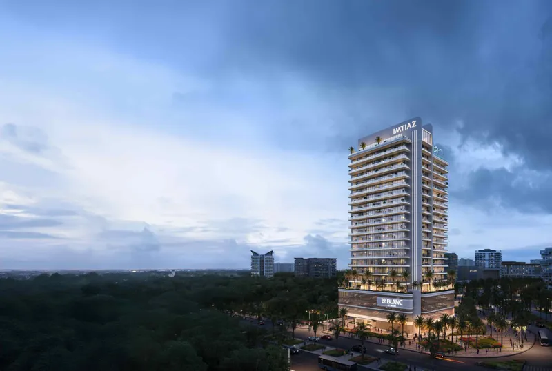 Le Blanc by Imtiaz tower in Dubailand Residence Complex at dusk