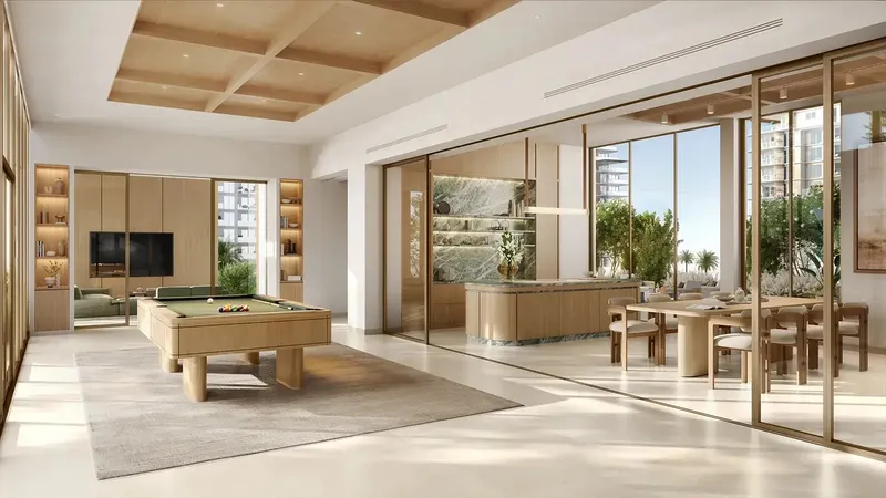 Render of the residents' clubhouse lounge with a pool table at Lunara on The Strand