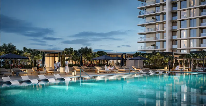 Render of the Lyvia by Palace infinity pool and pool deck at dusk