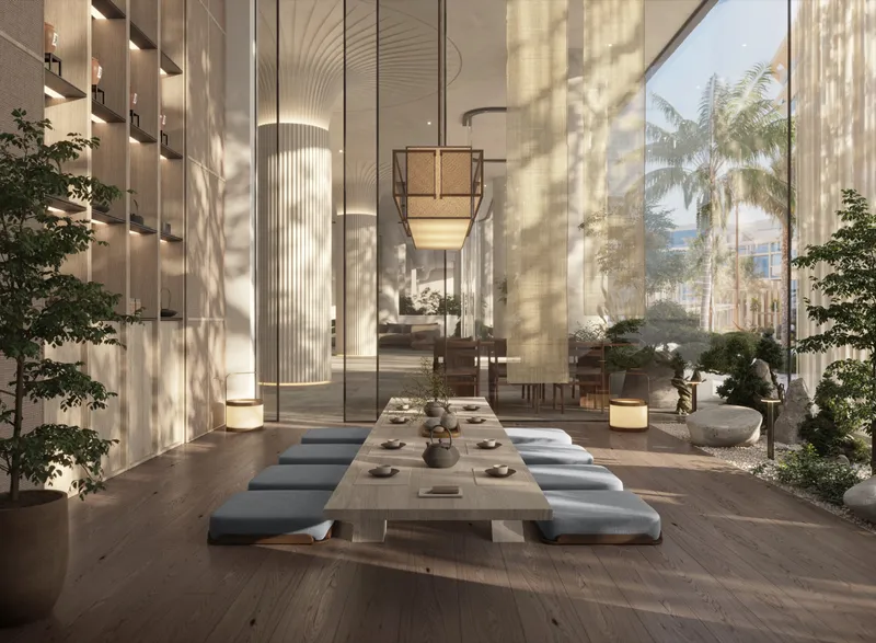 Render of the Mamsha Palm tea room with a low table, floor cushions and full-height shelving