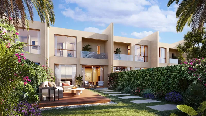 Rear garden of a townhouse with a timber deck, outdoor lounge and lawn