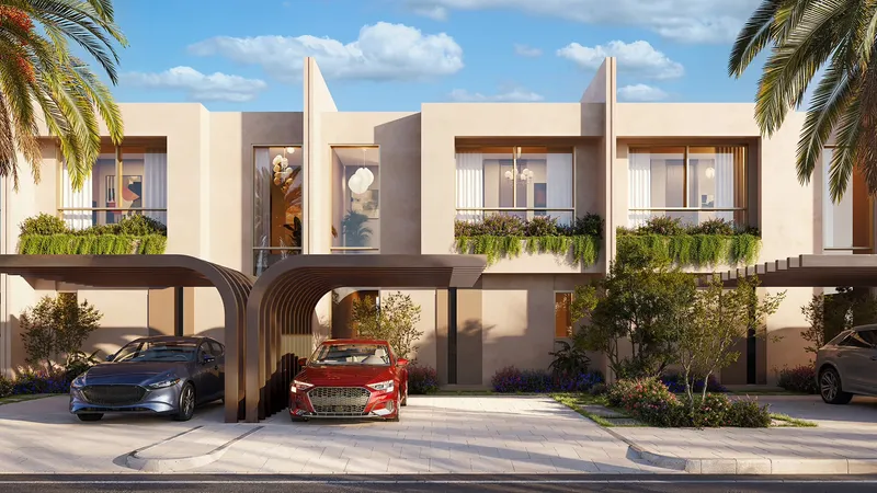 Row of two-bedroom townhouses with planted balconies and arched car porches