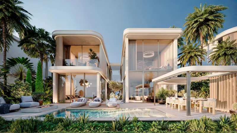 Villa garden with a private pool, sun loungers and a shaded dining area