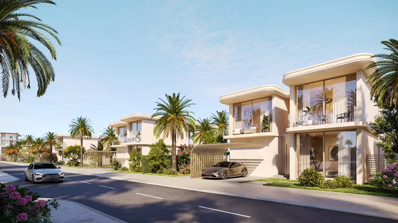 Four-bedroom villas with curved rooflines along a palm-lined street
