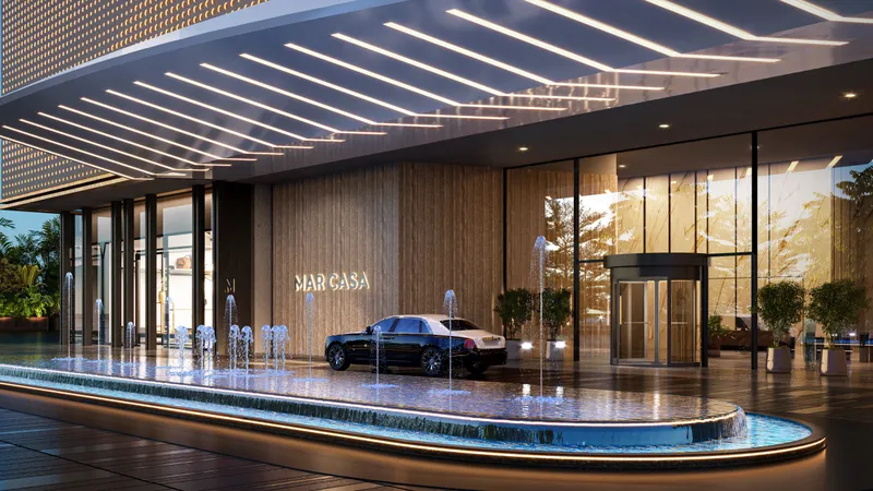 Render of the Mar Casa entrance at night, with a canopy and water feature at the drop-off