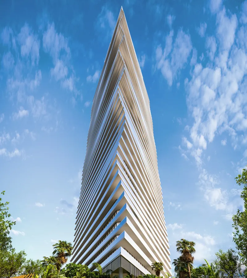 Render of the 52-floor Mar Casa tower in Dubai Maritime City, with its wave-shaped facade against a blue sky
