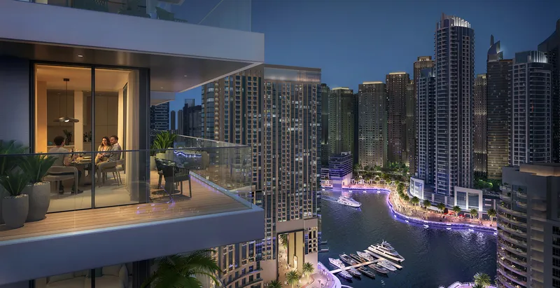 Render of a Marina Cove balcony at night overlooking the Dubai Marina canal and towers