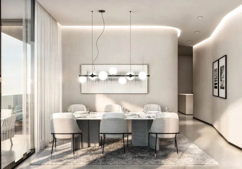 Dining area in a Marlin II apartment with curved walls and pendant lighting (developer render)