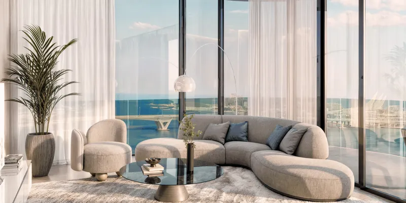 Living room in a Marlin II apartment with floor-to-ceiling windows and sea views (developer render)