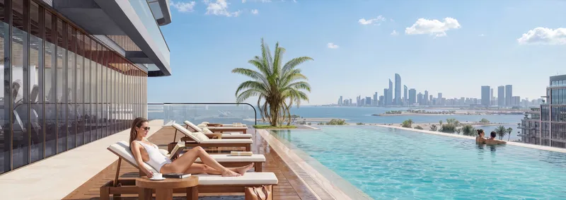 Rooftop-style pool deck at Marlin Icon with loungers and a view of the Abu Dhabi skyline (developer render)