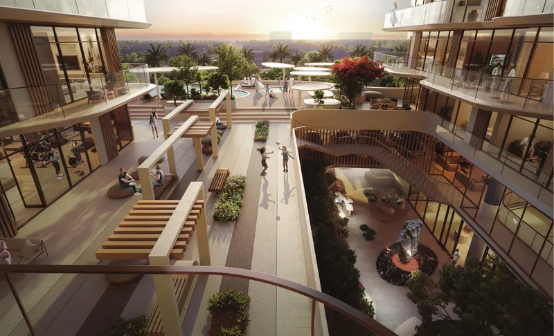 Open-air central courtyard with walkways, seating and planting between the wings of Marquis Horizon