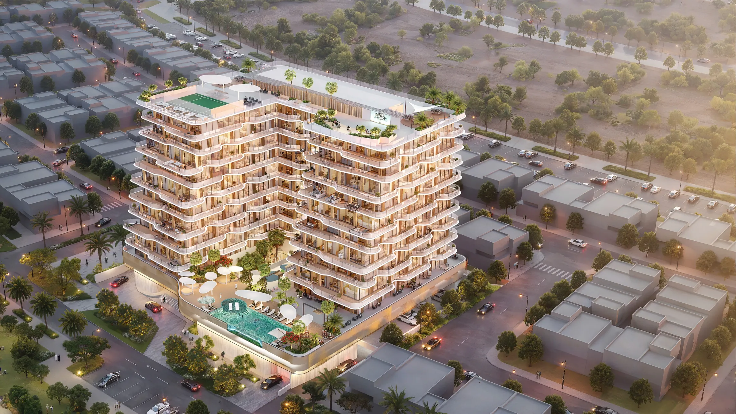 Aerial view of Marquis Horizon, a mid-rise building with wavy balconies, a podium pool and a rooftop padel court in Dubai South