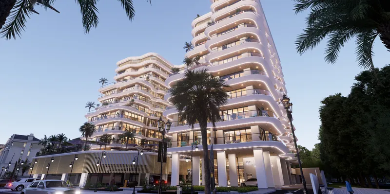 Street view of Marquis Horizon at dusk with its stepped, curved white balconies