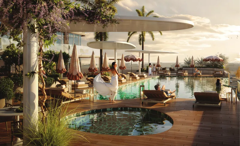 Infinity pool with sunbeds, parasols and a round plunge pool on the amenities deck at Marquis Horizon