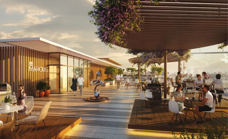 Rooftop terrace with a barbecue and dining area under a pergola at Marquis Horizon