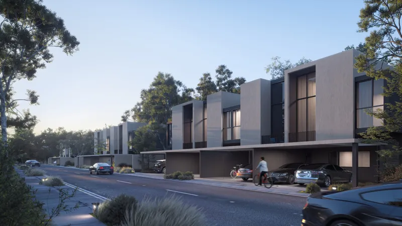 Render of the garden side of townhouses at Dalia, Masaar 3, facing a tree-lined path
