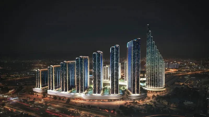 Night render of the Binghatti City towers lit up in Nad Al Sheba