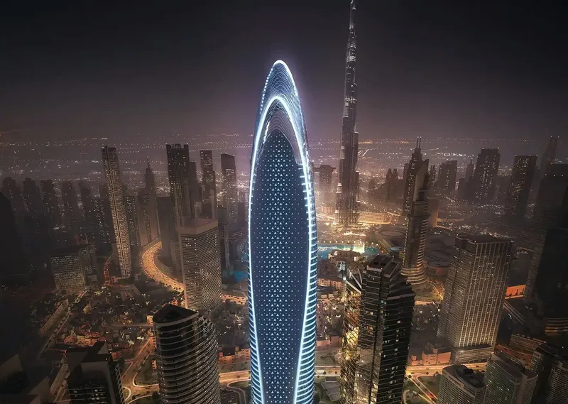 Aerial night render of the Mercedes-Benz Places | Binghatti tower with its lit outline, the Burj Khalifa behind