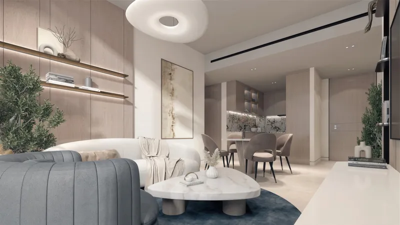 Open living and dining room with a curved sofa and wall shelving in a Meriden Beach Residences apartment