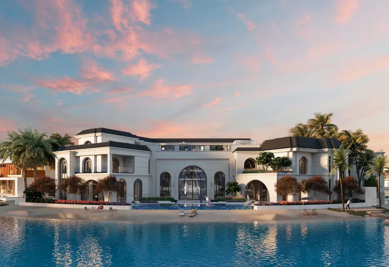 Render of a Monaco Mansions villa with arched windows seen across the lagoon at dusk
