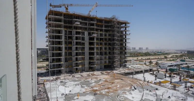 Construction photo of a Naya at District One building structure with podium works in front