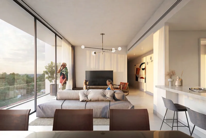 Render of a Nesba 1 apartment living room with a grey sofa, a breakfast counter and full-height sliding windows to a balcony
