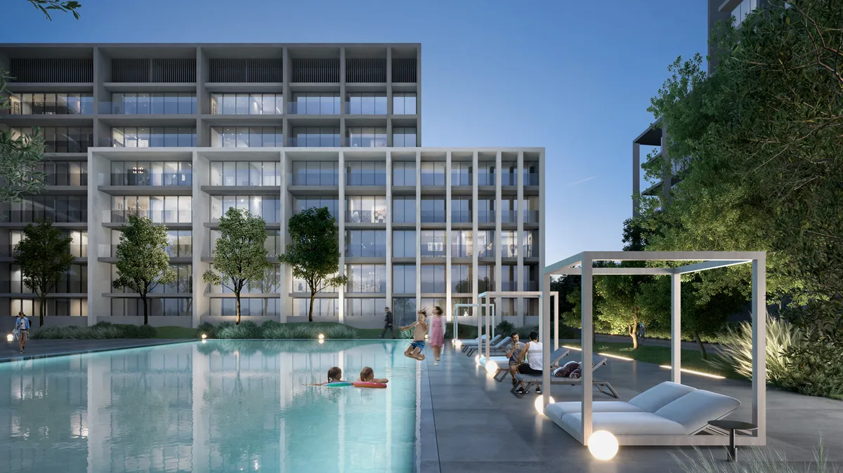 Dusk render of the residents' swimming pool, cabanas and sun loungers in the courtyard of the Nesba apartment buildings at Aljada