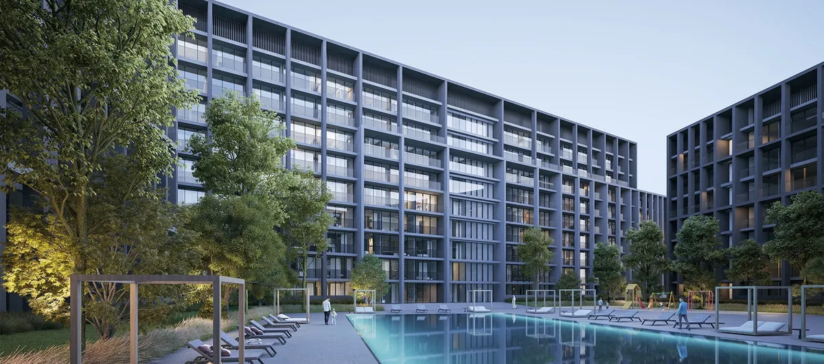 Dusk render of the residents' swimming pool and sun loungers in the courtyard between the Nesba apartment buildings at Aljada, Sharjah