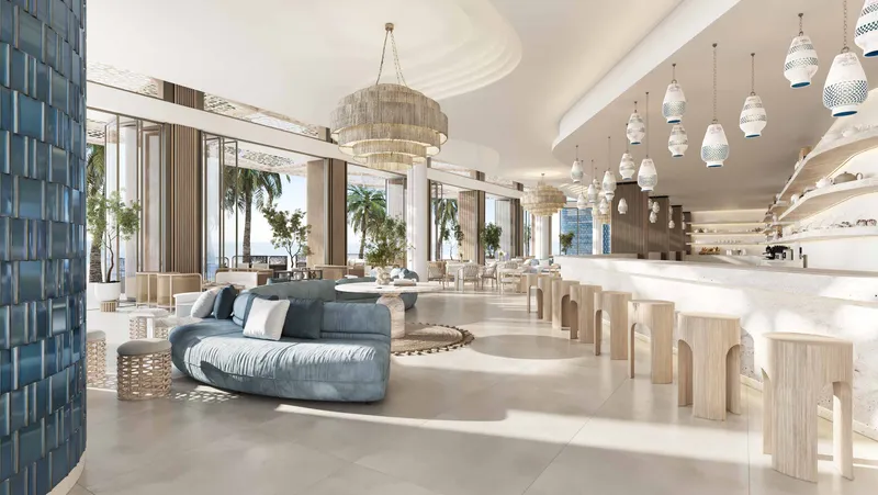 Café Nikki with a long bar, lounge seating and pendant lights at Nikki Beach Residences