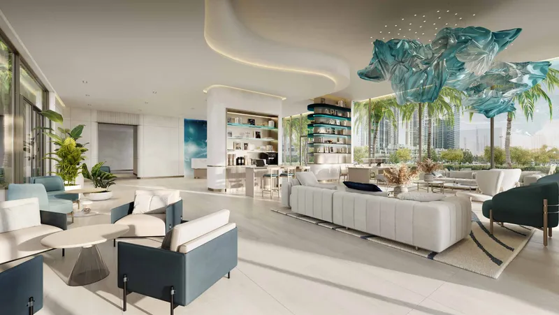 Residents' lobby lounge with a blue glass ceiling sculpture at Nikki Beach Residences