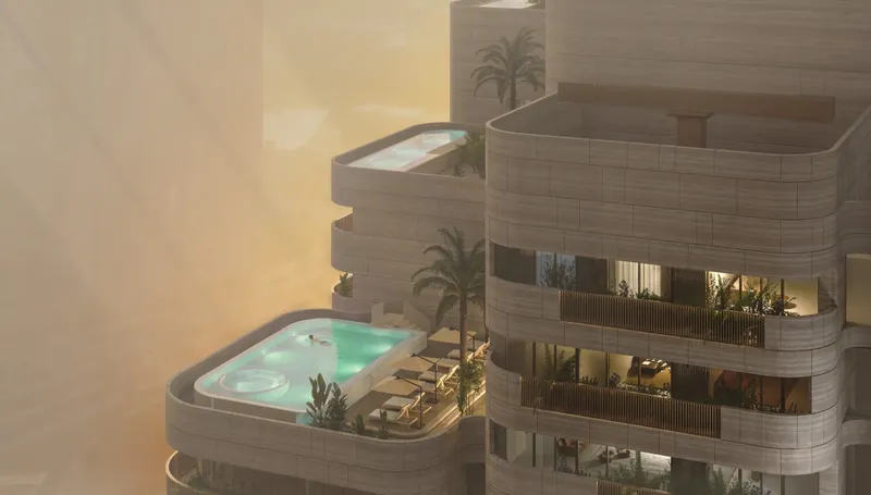 Stepped rooftop terraces with pools at the top of Nine Collective at sunset