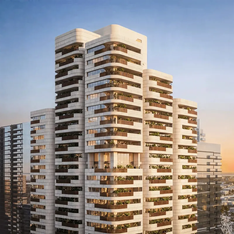 Upper floors of Nine Collective with curved stone-coloured balconies and planting