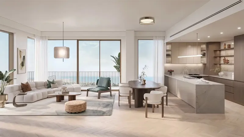 Render of a living room and open kitchen in a Nura apartment