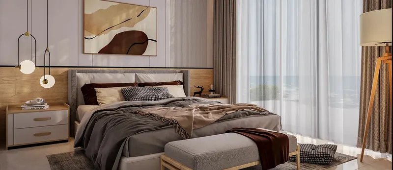 Bedroom in an Oceana apartment with full-height curtains and neutral finishes (developer render)