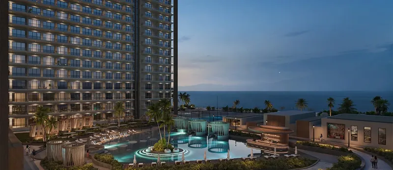 Oceana's lit pool and gardens at dusk, with the Gulf of Oman on the horizon (developer render)