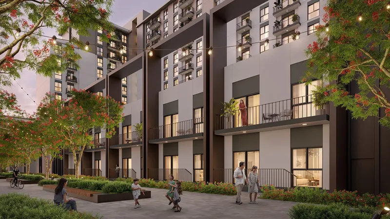 Render of the lower floors of Olbia with balconies over a tree-lined pedestrian walkway strung with lights