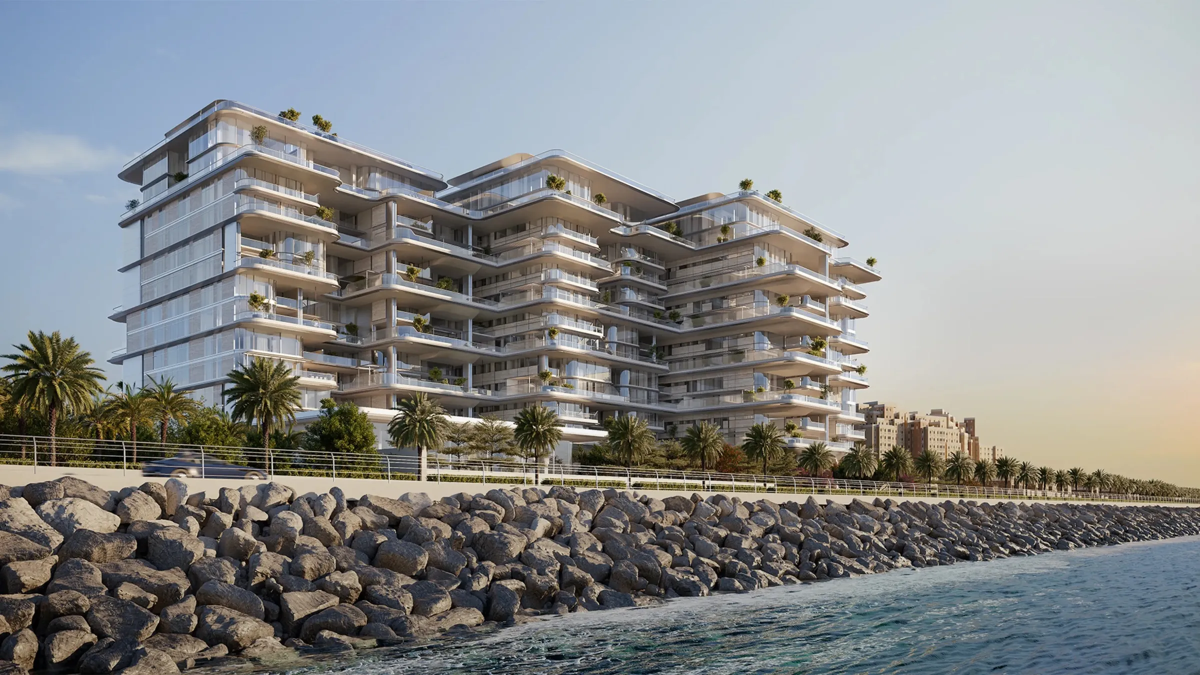 Render of ORLA's linked, terraced buildings seen from the sea on the Palm Jumeirah crescent