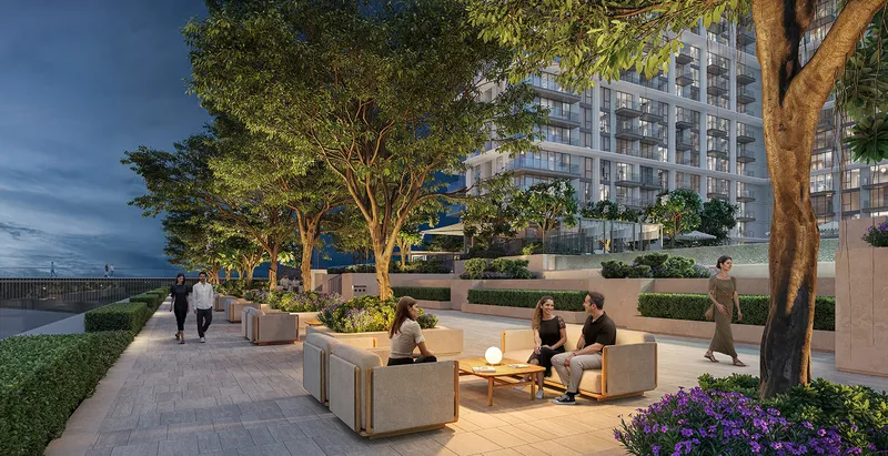 Render of residents seated on the tree-lined podium deck at Palace Residences Hillside in the evening