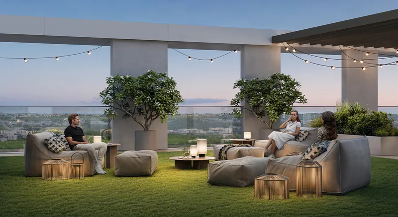 Render of residents on the lawn of the Palace Residences Hillside rooftop terrace at dusk