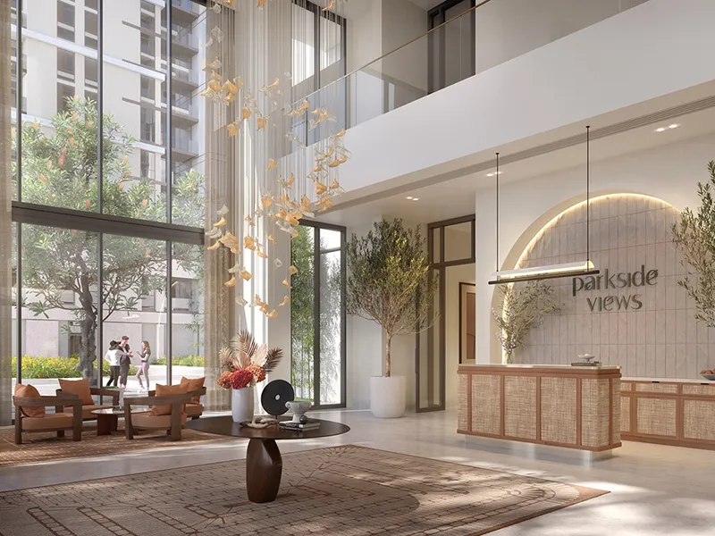 Double-height entrance lobby at Parkside Views with seating and a reception desk