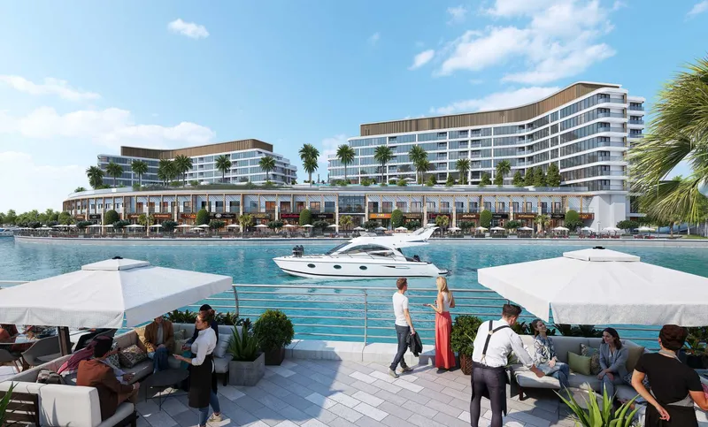 Pearlside Marina Residences seen across the canal from a waterside dining terrace