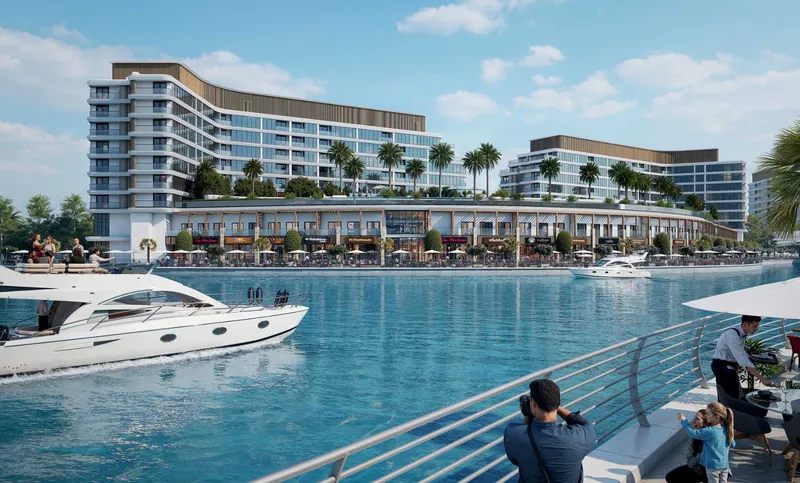 The two buildings of Pearlside Marina Residences above a shared landscaped podium on the waterfront