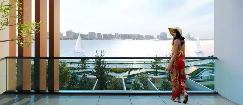 Balcony at Perla 2 looking over landscaped gardens to the water of Yas Bay (developer render)